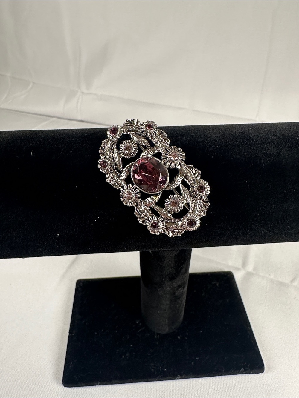 Silver-Tone Floral Brooch with Purple Center Stone